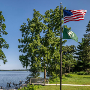 The Commodore – A Bartolotta Restaurant Lakeside Lawn and Flag 